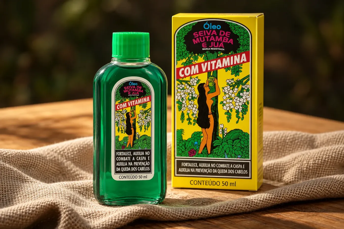 Óleo Seiva de Mutamba e Juá com Vitamina, frasco e caixa sobre um pano de linho numa mesa de madeira